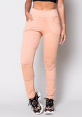 Calça Moletom Amêndoa Com Recortes E Bolso Dlk