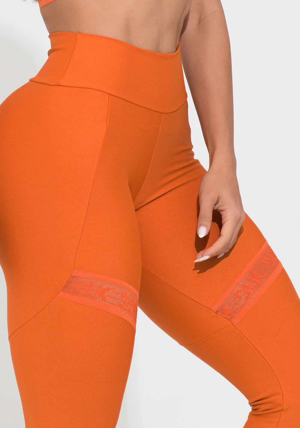 Legging Fitness Feminina Laranja Com Recorte E Elástico Vazado Action Dlk