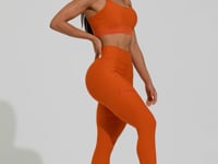 Legging Fitness Feminina Laranja Com Recorte E Elástico Vazado Action Dlk